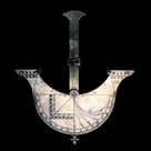 Detail of the ship-shaped sundial, showing the initials 'S.F.'
