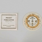 A pocket forecaster dial.