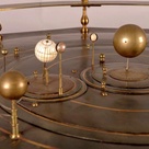 Detail from the grand orrery showing several planets and their satellites