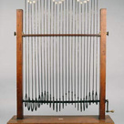 Powell's machine for demonstrating wave motion