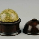 Pocket globe by London globemaker Newton, in a wooden case.