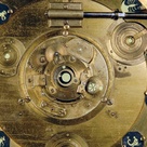 Detail from the face of the projecting planetarium showing part of the mechanism and some of the planets