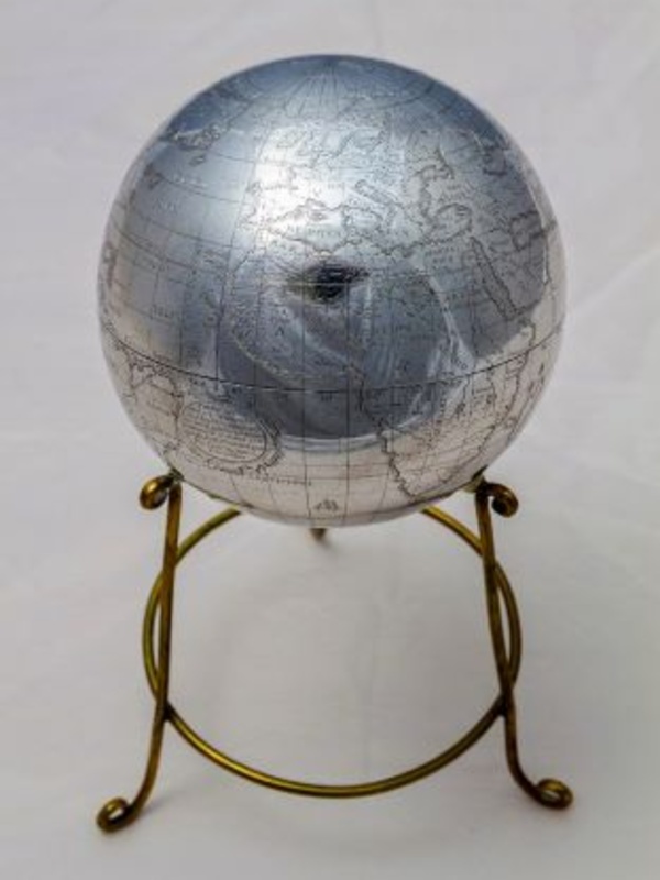 Silver-coloured metal globe