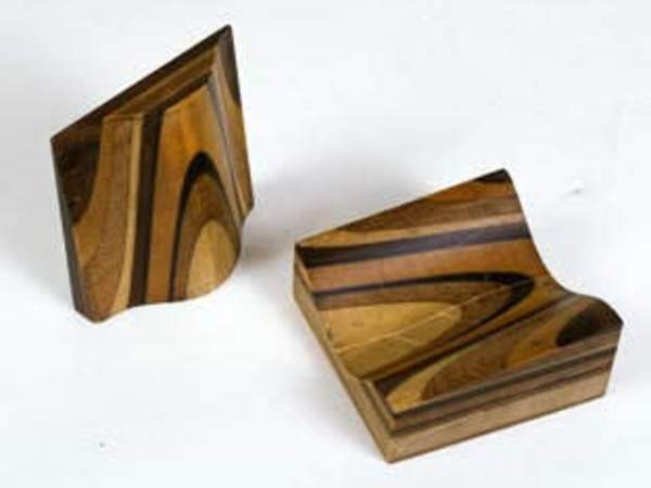 A carved geological model showing layers of wood.
