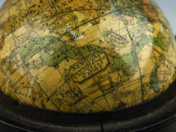 Pocket globe showing the inscription "Newton's improved pocket celestial globe".