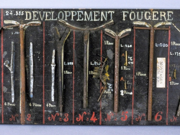 Prototype metal structure showing the development of a fern.