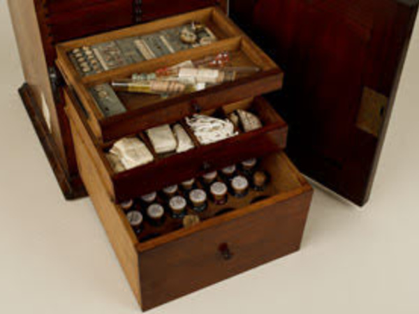 Wooden cabinet containing various slide-making materials used by Elcock.