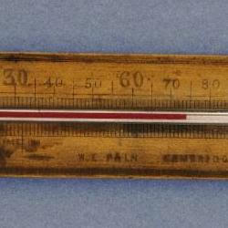 Wooden framed thermometer by W. E. Pain.