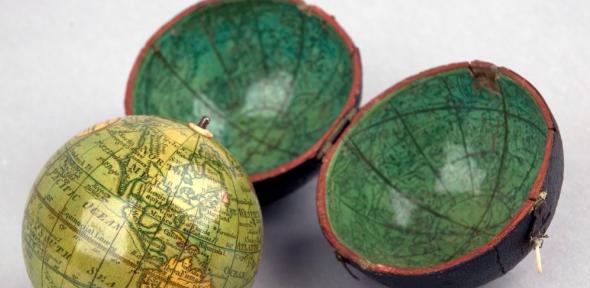 Darton's pocket globe, with celestial cartography on concave surface of case. Other makers used this surface to show the order of the planets or the regions of the world known to Caesar (Wh.0076). Detail of Darton's pocket globe with celestial cartography on the concave surface of its spherical case.