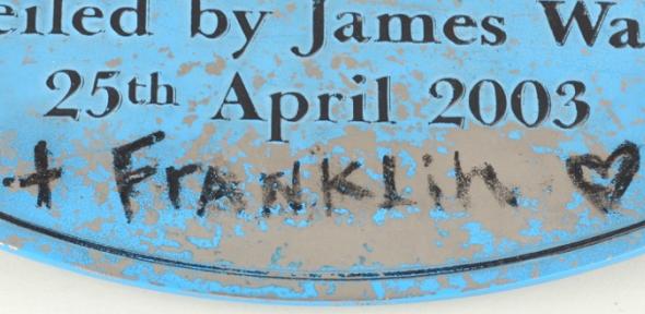 blue plaque, removed from The Eagle pub, commemorating Watson and Crick's announcement of the discovery of DNA structure, with '+franklin' in graffito