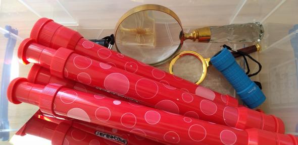 A box of equipment including telescopes and mirrors 
