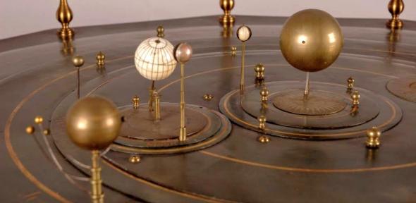 Detail from the grand orrery showing several planets and their satellites