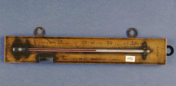 Wooden framed thermometer by W. E. Pain.