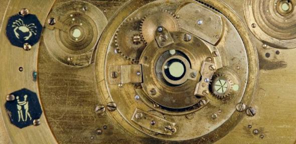 Detail from the face of the projecting planetarium showing part of the mechanism and some of the planets