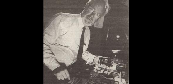 Francis Hookham portrait with calculator collection, 1988