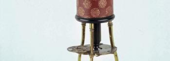 Detail showing the stage and objective lens of the 1730s microscope used to take the image of a flea, shown below.